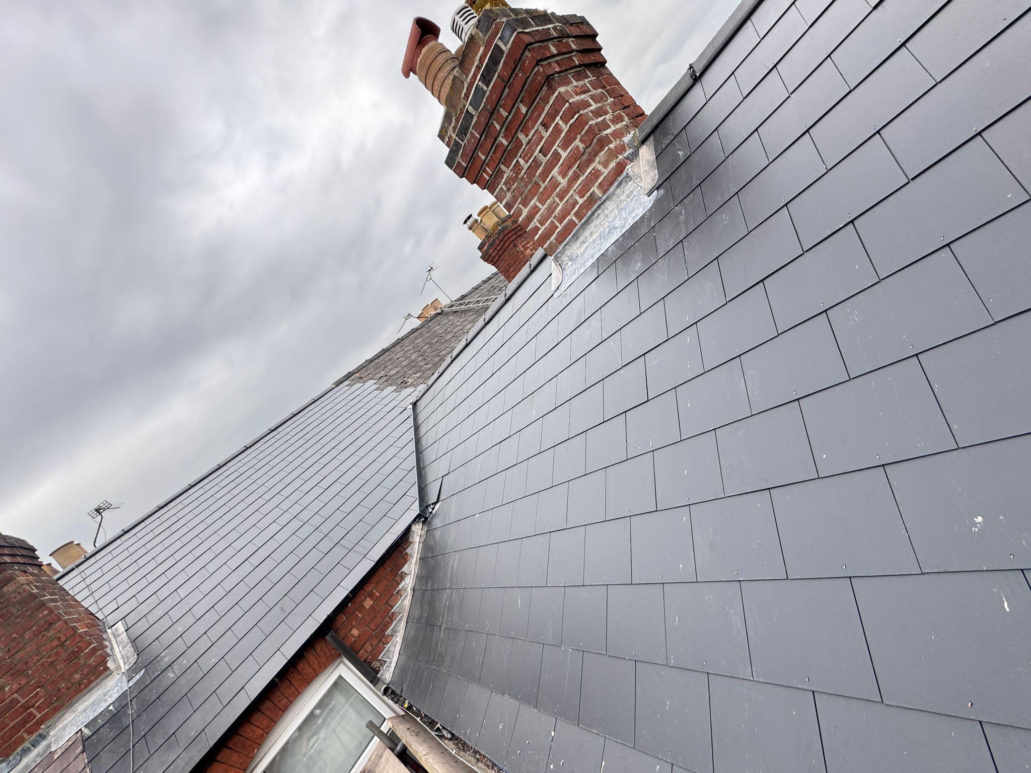Finished new tiled roof with solar panels on a Suffolk property
