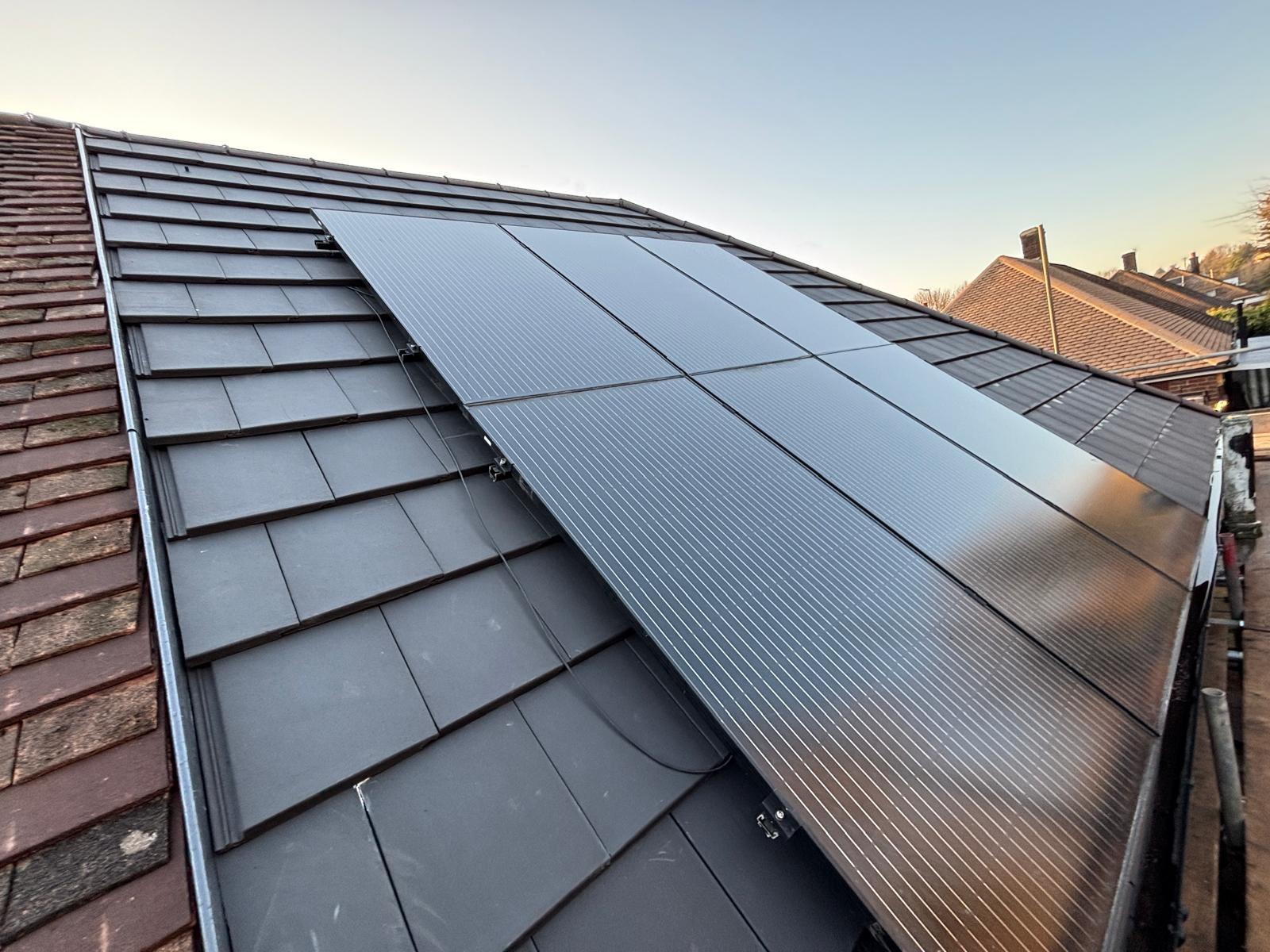 New tiled roof with solar panel installation by ATS Roofing and Building